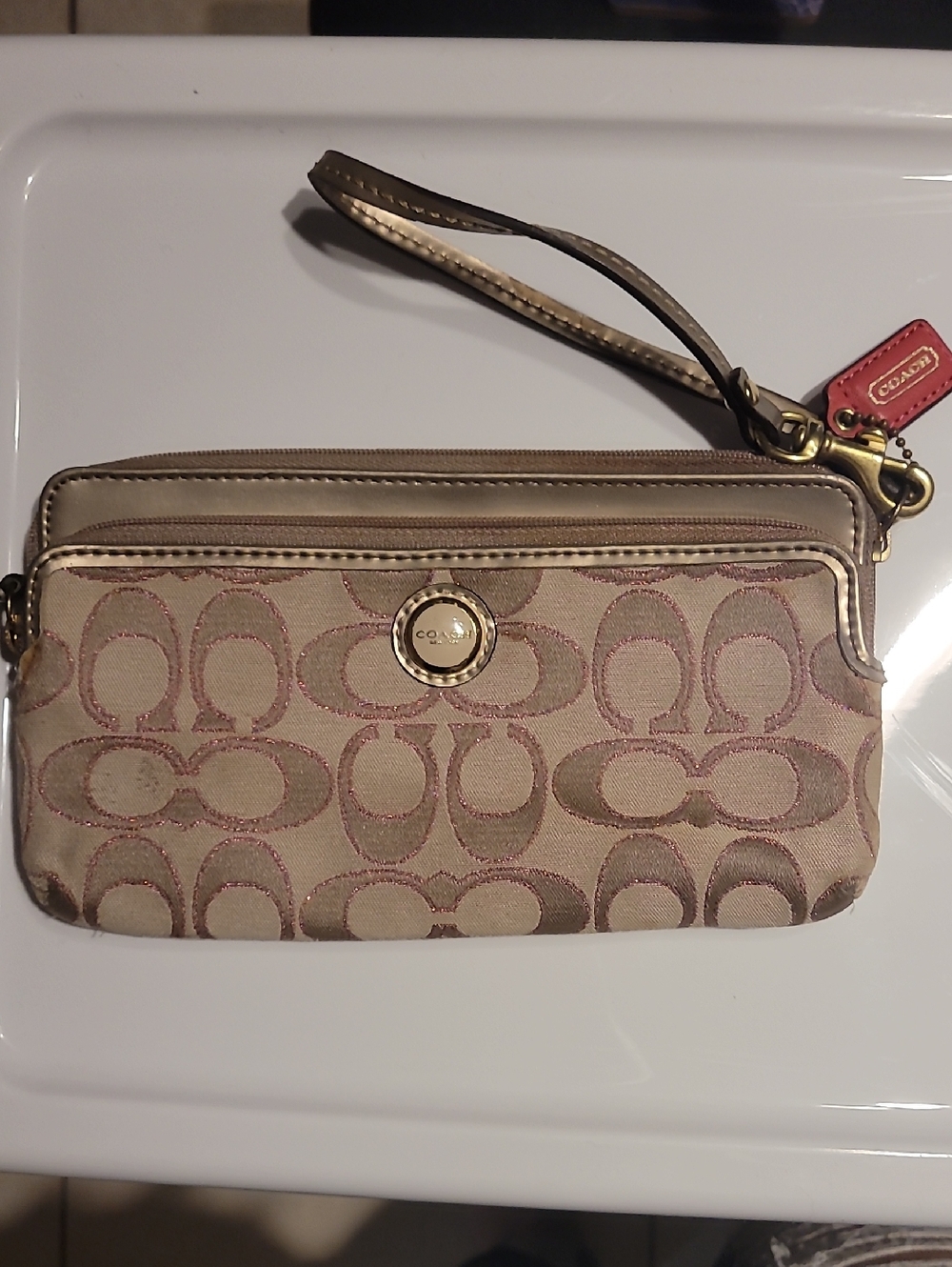 Coach Signature Canvas Wristlet in Beige and Metallic Pink Trim